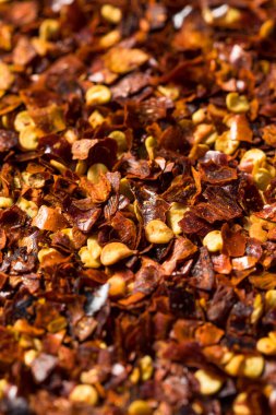 Organic Raw Red Pepper Flakes in a Bowl