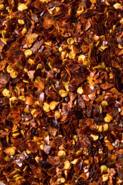 Organic Raw Red Pepper Flakes in a Bowl