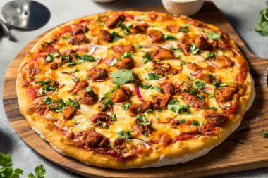 Homemade Indian Chicken Tikka Masala PIzza with Onions and Cilantro