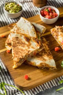 Homemade Carnitas Pork Cheesey Quesadilla with Tomato and Corn clipart
