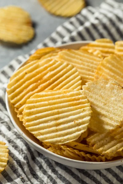 Salty Ruffled Potato Chips in a Bowl