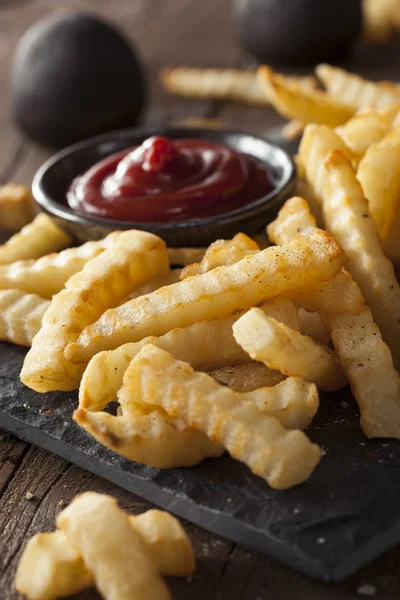 Unhealthy Baked Crinkle French Fries — Stock Photo, Image