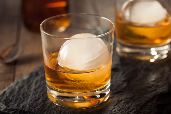 Bourbon Whiskey with a Sphere Ice Cube — Stock Photo, Image