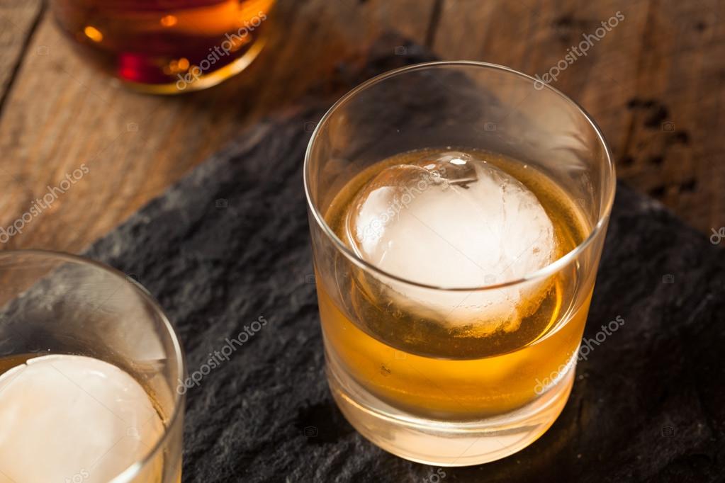Bourbon Whiskey with a Sphere Ice Cube Stock Photo by ©bhofack2 80713736