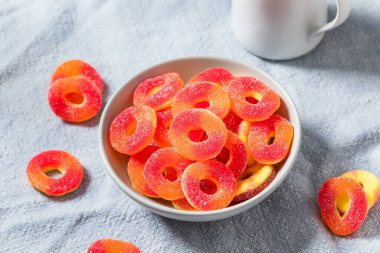 Sweet Round Peach Ring Candy in a Bowl with Sugar