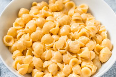 Homemade Healthy Macaroni and Cheese Shells with Cheddar in a Bowl