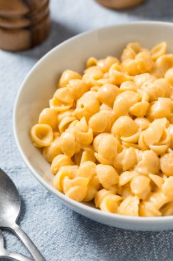 Homemade Healthy Macaroni and Cheese Shells with Cheddar in a Bowl