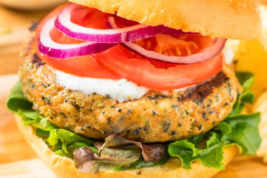 Organic Healthy Salmon Patty Burger with Lettuce and Tomato