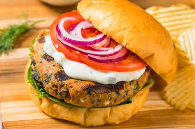 Organic Healthy Salmon Patty Burger with Lettuce and Tomato