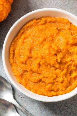 Raw Organic Cooked Pumpkin Puree in a Bowl