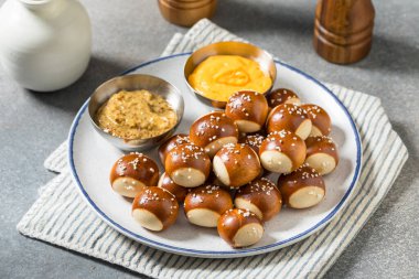 Salty Homemade Soft Pretzel Bites with Mustard and Cheese