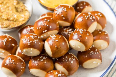 Salty Homemade Soft Pretzel Bites with Mustard and Cheese