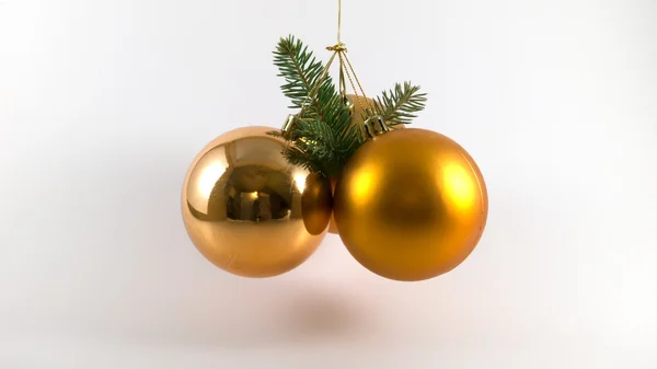 Három fényes sárga karácsonyi golyókat, három fenyő fa ágai. — Stock Fotó