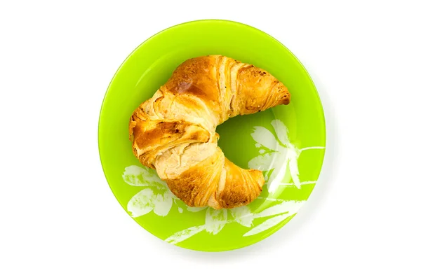 Croissant em prato — Fotografia de Stock