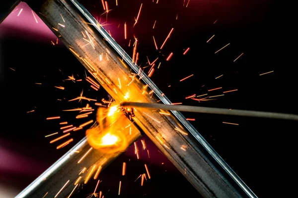 welding sparks, construction and metal work industrial concept, metal welding with sparks, laborer or labor day concept