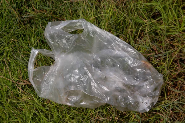 bag waste, plastic garbage bags on the grass, bag plastic waste on floor grass, trash, rubbish, pollution from waste