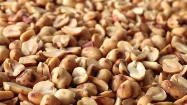 roasted peanuts, showing golden brown peanuts texture, close-up, delicious peanuts snack rich in protein and nutrition, perfect peanuts background