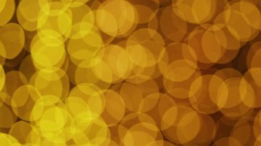 Yumuşak altın bokeh ışıkları bulanık bir şekilde hareket ediyor, sıcak ve zarif bir atmosfer yaratıyor, şenlikli veya lüks arka planlar için mükemmel.
