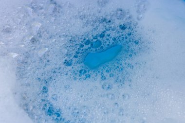 Detergent Foam and Blue Soapy Water with bubbles, Bubbles Soap Background for cleaning, laundry, hygiene, freshness, and household sanitation concepts