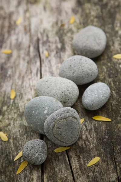 Pebbles on weathered wood