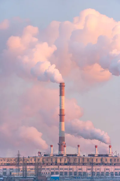 Industrial factory pollution, smokestack exhaust gases. Industry zone, thick smoke. Climate change and global warming. Vertical photo