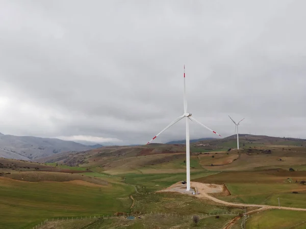 Wind turbines in wind power farm. Renewable and clean energy source - green energy