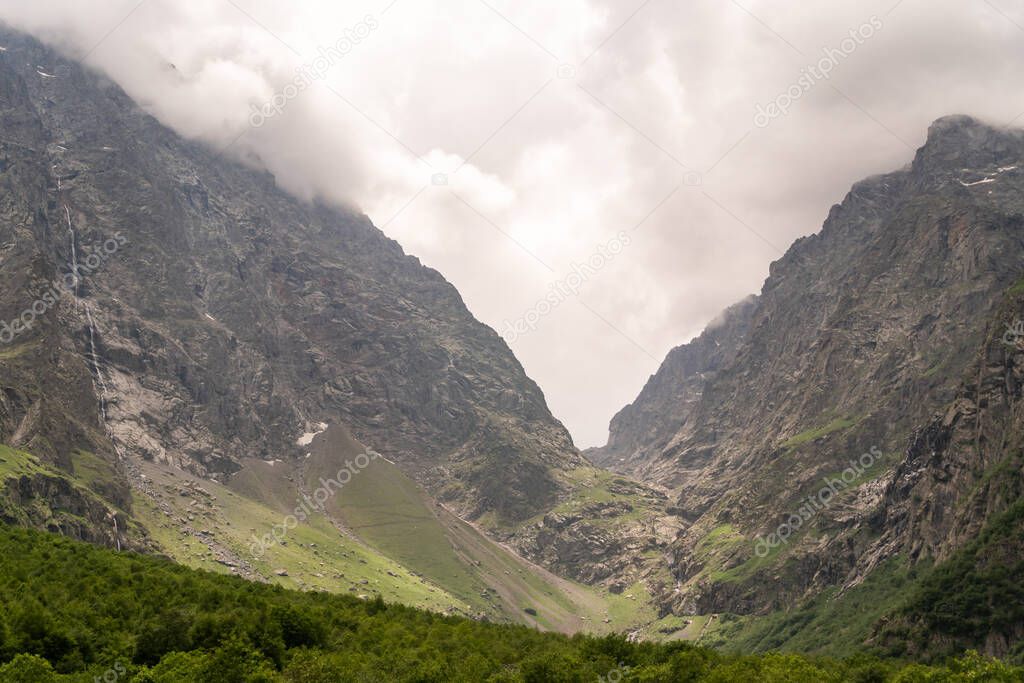 Fantastic view of mountains in North Ossetia, Alania with cloudy sky. Concept of travel the world. Russia