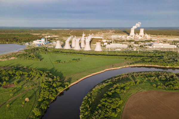 Aerial view of Industrial zone with power station nuclear energy production. Nuclear power plant production clean energy.