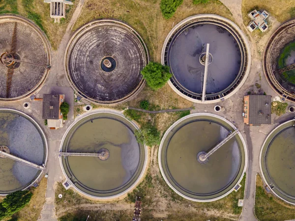 Round wastewater cleaning reservoirs at a sewage treatment facility. Grey water recycling, aerial view