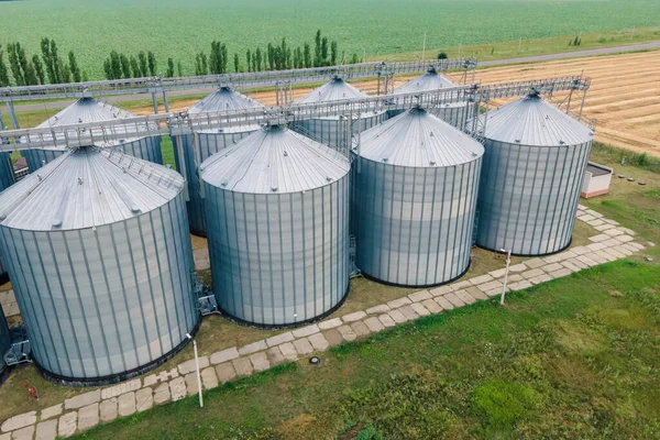 Grain silos elevator at the field. Grain storage in large silos aerial view