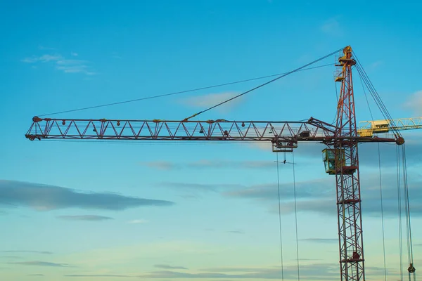 Construction jib crane tower at construction site of new residential building