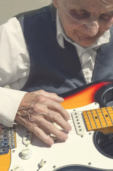 Elderly woman playing guitar. — Stock Photo, Image