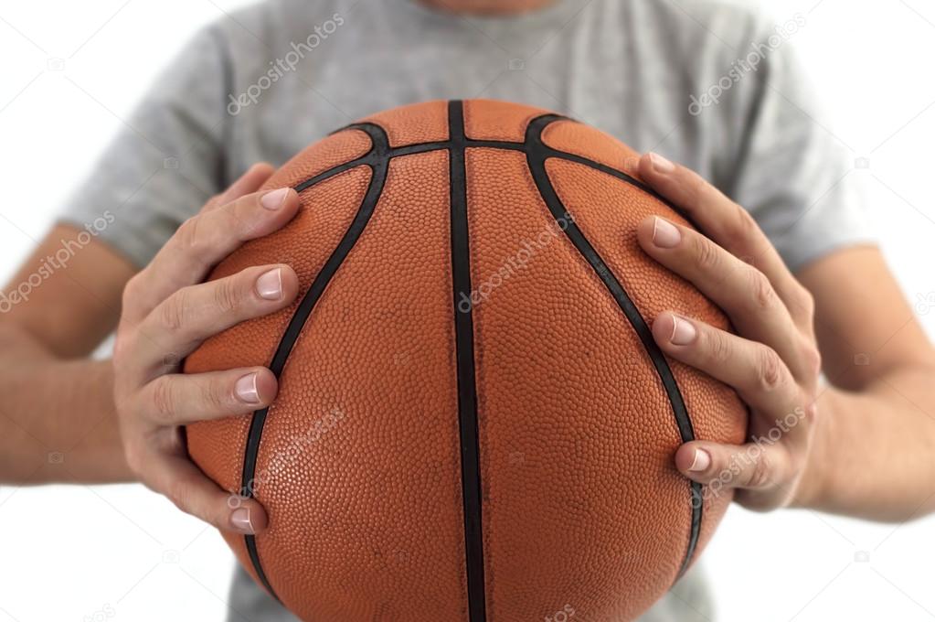 Basketball ball in hands.