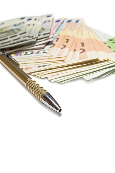 Pen with euro banknotes isolated on white background. — Stock Photo, Image