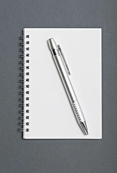 Pencil on a notebook — Stock Photo, Image