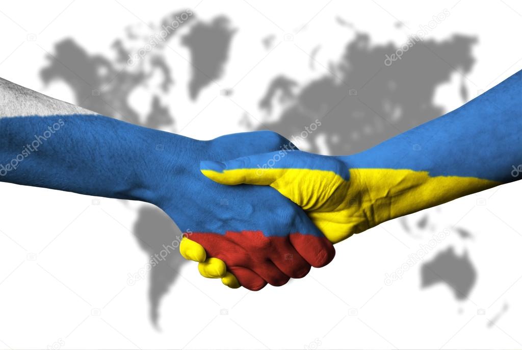 Russian flag and Ukraine flag across handshake.