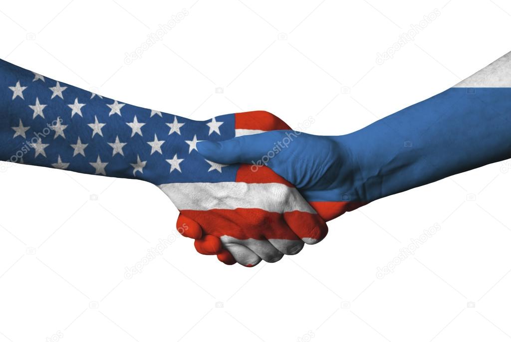 Usa and Russian flag across handshake.