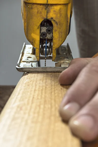 Electric jigsaw tool cutting wood — Stock Photo, Image