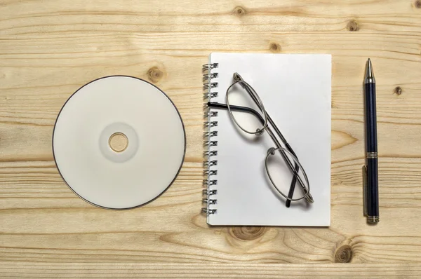 Blank stationery set : glasses, CD, notebook, and penci — Stock Photo, Image