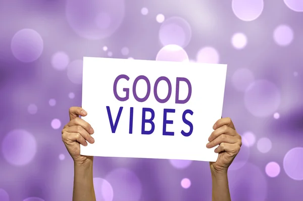 GOOD VIBES card in hand with abstract light background. — Stock Photo, Image