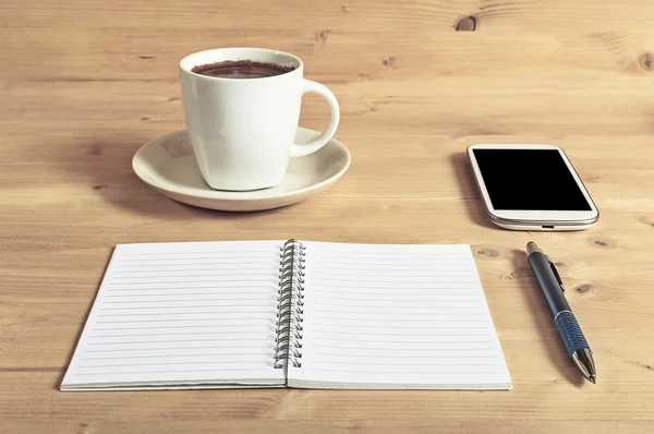 Still life photo of smartphone, notebook, coffee and pencil on w — Stock Photo, Image