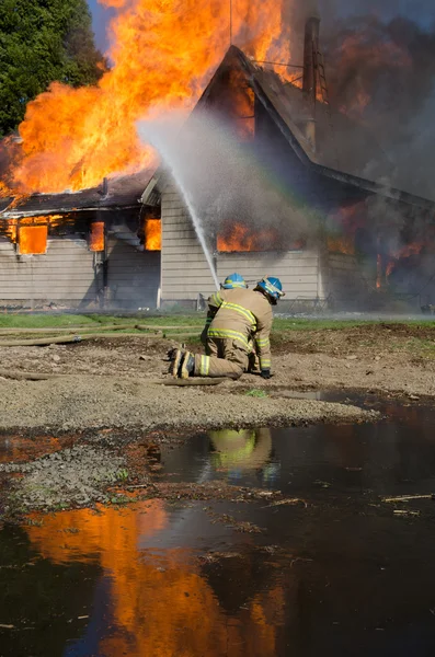 Brandmän utbildning Royaltyfria Stockbilder