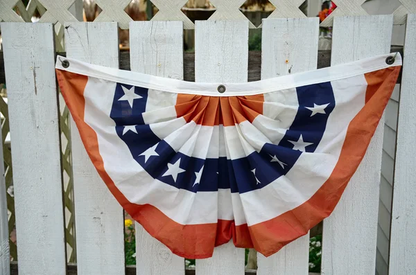 Bunting on a picket fence