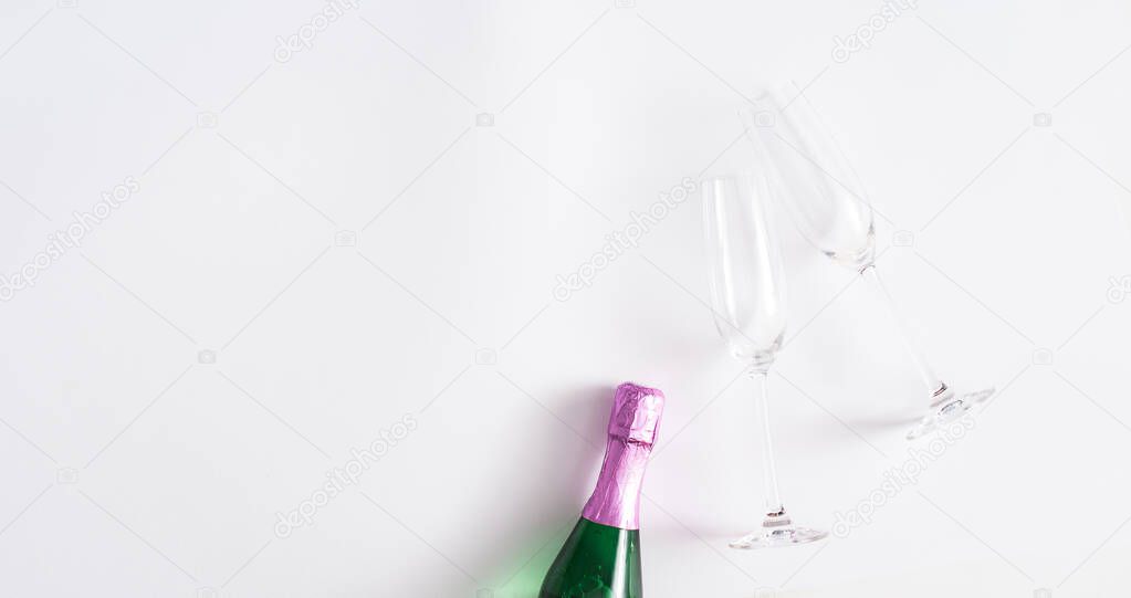 Creative flat lay composition with bottle of champagne and space for text on white background. Flat lay, copy space for text.