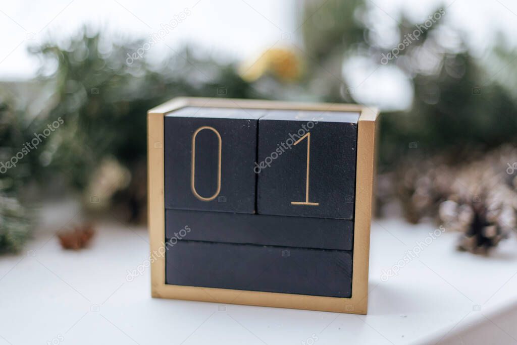 Wooden cubes with date on white background.The thirtieth day of the winter month, a calendar for the workplace. Age.