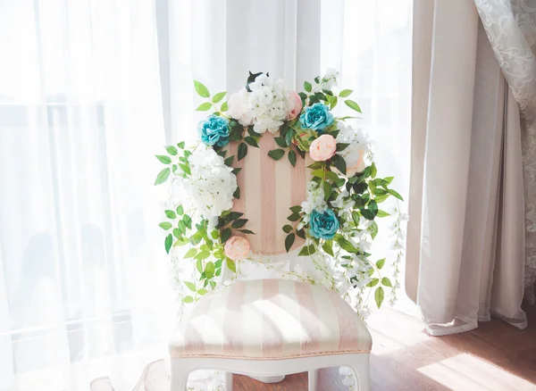 Beautiful wedding decoration on chair Stock Photo