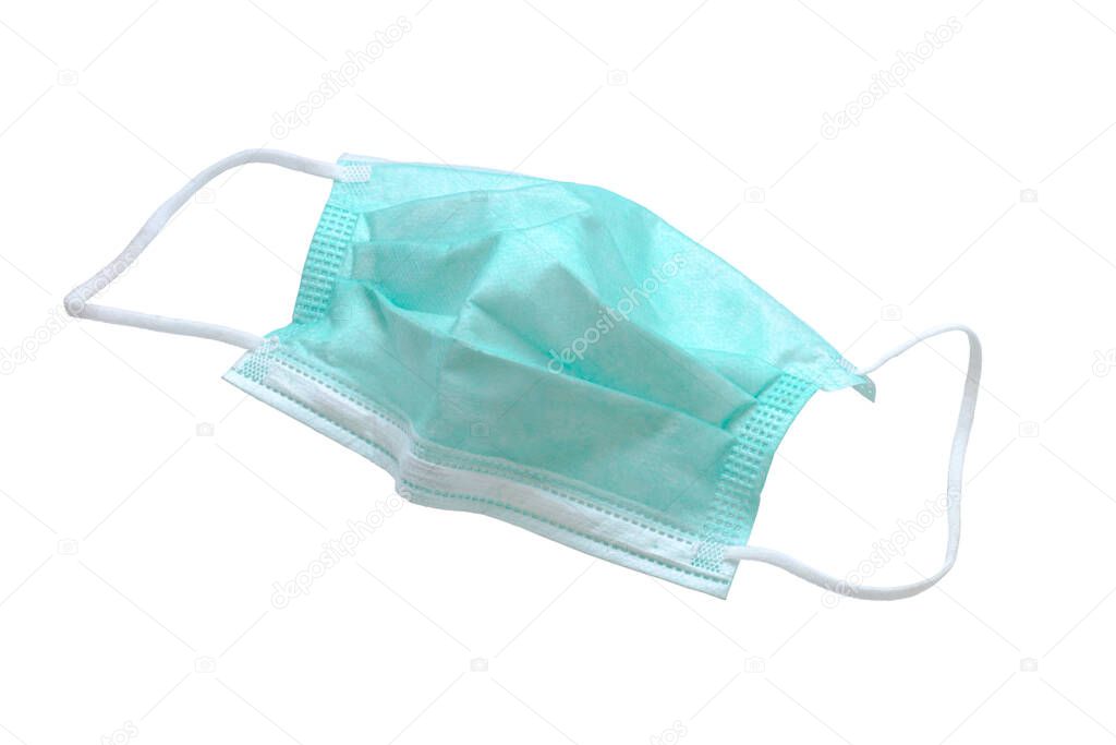 Used green medical surgical mask, Medical protective mask on white background. Disposable surgical face mask cover the mouth and nose. cliping path.