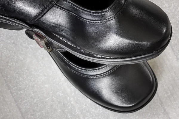 Close Up a pair of worn and torn shoes. — Stock Photo, Image