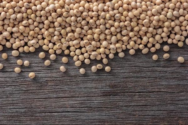 Soybeans on old wooden background. — Stock Photo, Image