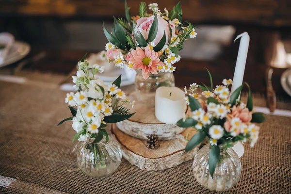 Decorations and wildflowers on festive table Stock Photo